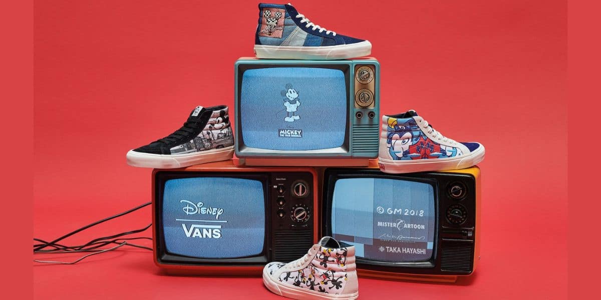 Disney Vans sneakers displayed on retro TVs, featuring Mickey Mouse screens—ideal for fans exploring Disney Springs.