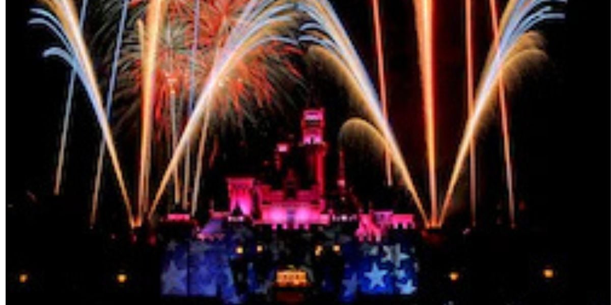 Dazzling fireworks illuminate Sleeping Beauty Castle at Disneyland, creating a magical nighttime atmosphere for guests to enjoy together.