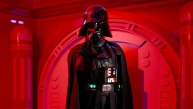 Darth Vader stands in a red-lit chamber at Disneyland Paris' Starport