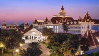 Exterior of Hong Kong Disneyland Hotel at sunset