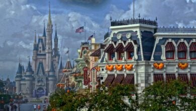 Cinderella Castle behind Halloween decorations on Main Street, USA, at Magic Kingdom at Walt Disney World Resort