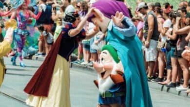 Snow White greets the Seven Dwarfs during Festival of Fantasy
