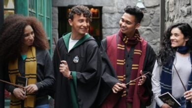Harry Potter fans in robes with wands in Universal's Diagon Alley