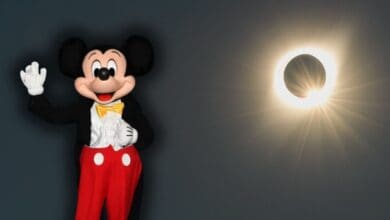 Disneyland Paris eclipse above Sleeping Beauty Castle and Mickey Mouse on August 12, 2026.