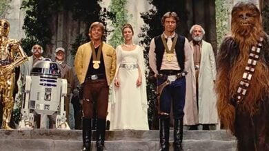 Luke Skywalker, Han Solo, Princess Leia, Chewbacca, and droids C-3PO and R2-D2 gather at the end of 'A New Hope'