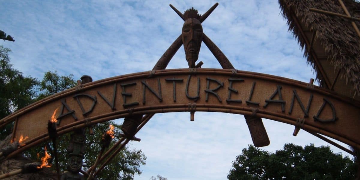 The Adventureland entrance sign at Disneyland Park