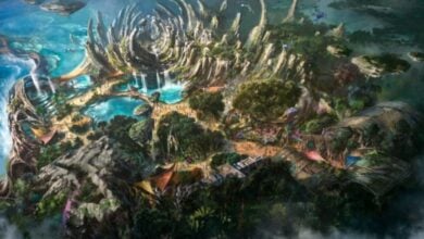 A magical island adventure zone featuring dramatic rock spires, cascading waterfalls, and sparkling lagoons along a scenic oceanfront—perfect for exploration and family fun.