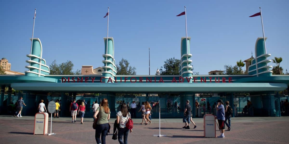 Guests stroll toward the iconic entrance of Disney California Adventure Park