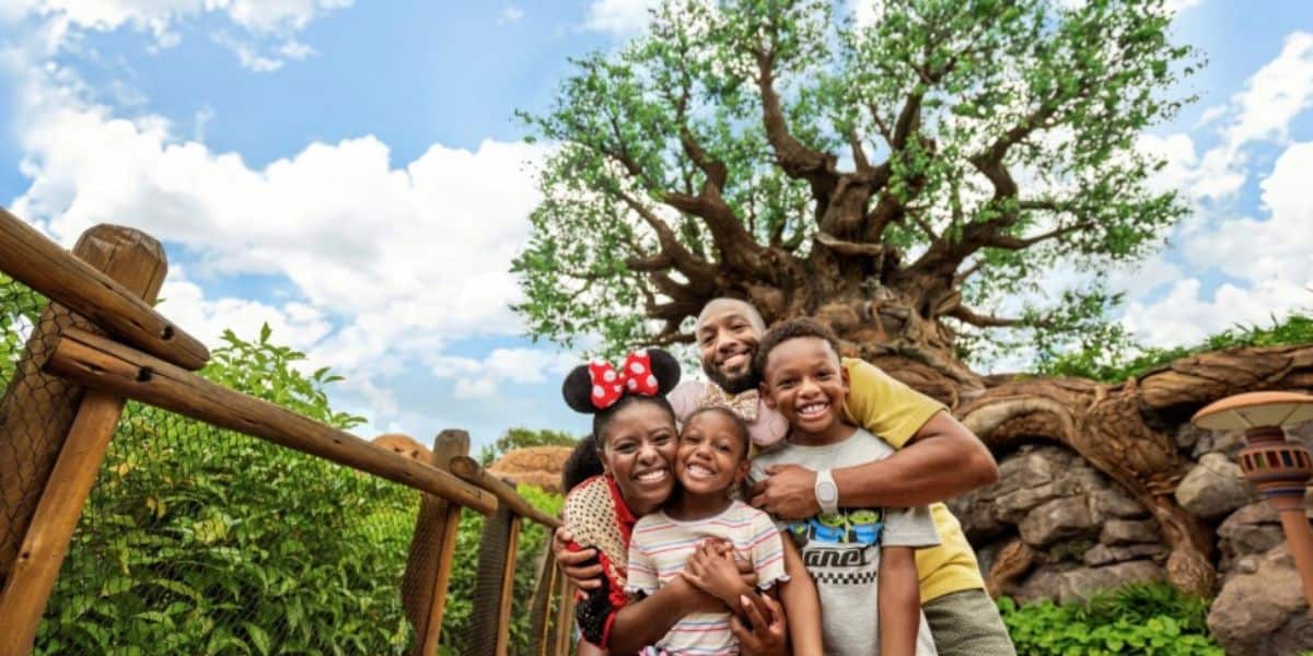 disney world family (guests) in front of tree of life in animal kingdom