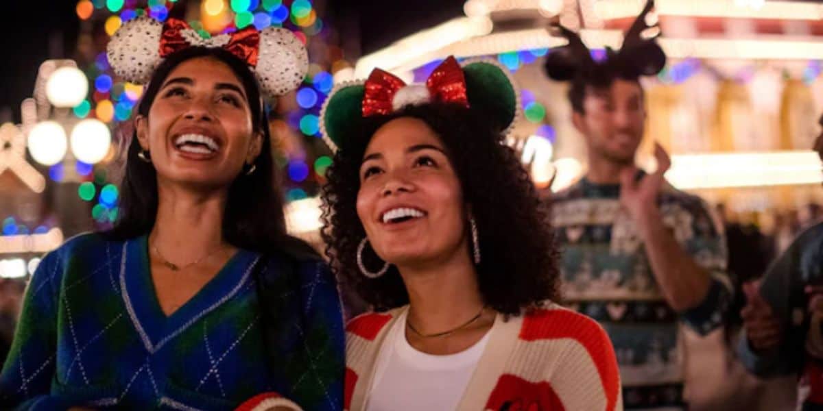 disney world guests at magic kingdom during christmas time