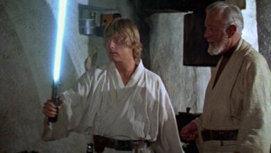 luke skywalker holds blue lightsaber in 'star wars'
