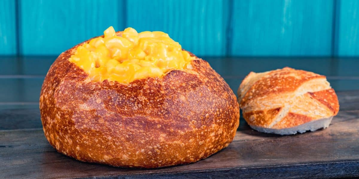 Creamy macaroni and cheese piled high in a sourdough bread bowl at Disney