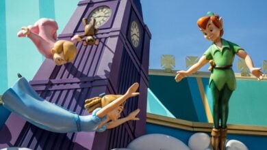 Peter Pan and the Darling children on top of the Peter Pan's Flight ride
