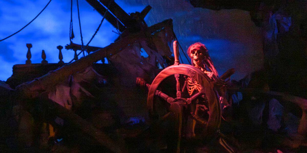 skeleton driving ghost ship on pirates of the caribbean ride in disney world's magic kingdom