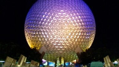 Spaceship Earth glowing at night at EPCOT