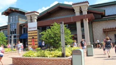 Guests stroll past the iconic World of Disney store at Disney Springs