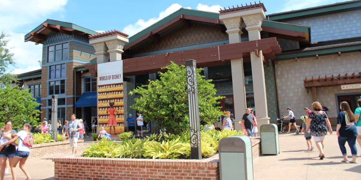 Guests stroll past the iconic World of Disney store at Disney Springs