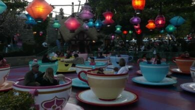 Guests spin in vibrant teacup ride vehicles on Mad Tea Party at Disneyland