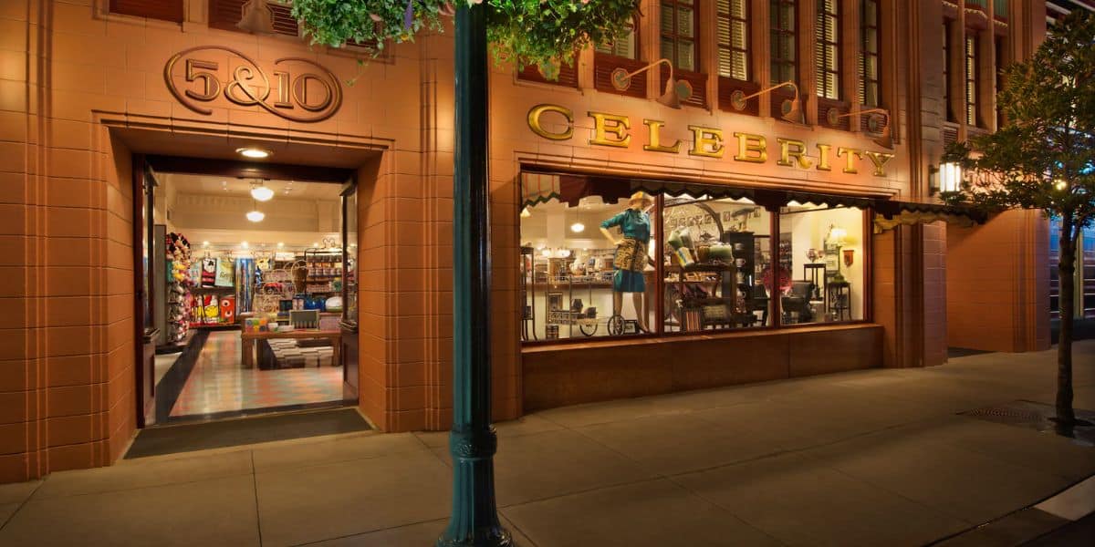 5 & 10 Celebrity shop at Disney Springs, featuring a large window display showcasing themed merchandise inside.