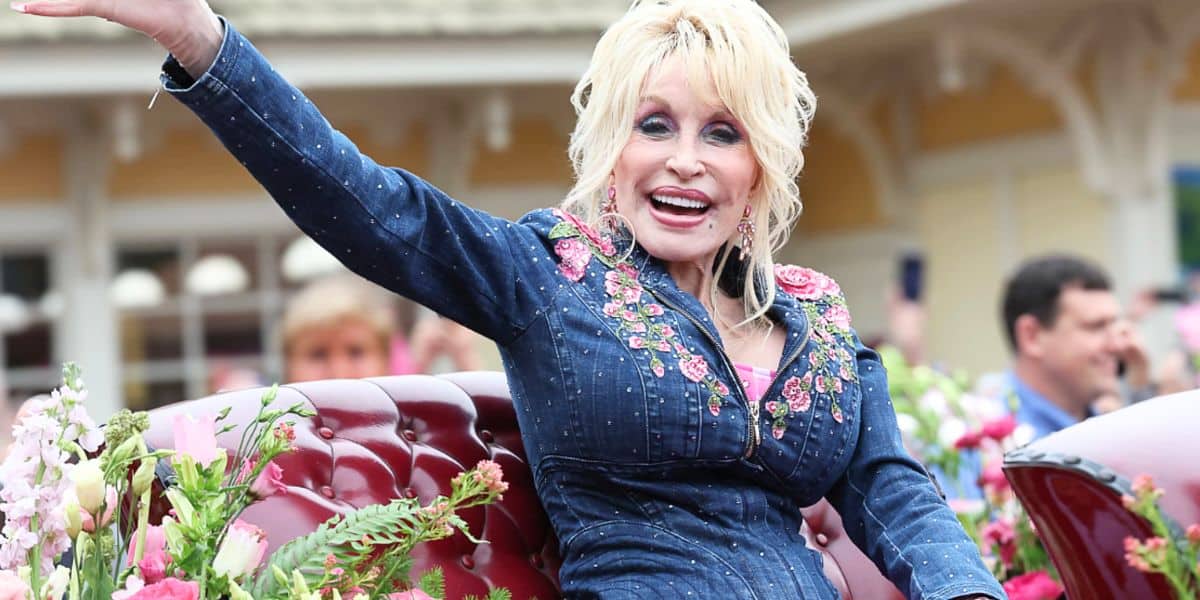 Dolly Parton waves to fans during Dollywood parade