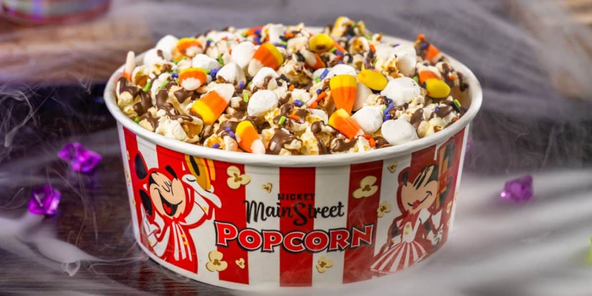 Buttered popcorn with mini marshmallows, candy corn, Halloween sprinkles, and milk chocolatey drizzle for Halloween at Disney World