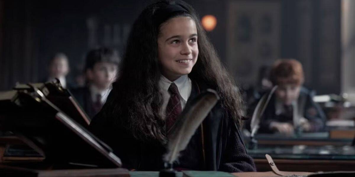 Hermione Granger (Arabella Stanton) smiling in class in HBO's Harry Potter tv series