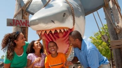 a family takes a picture with JAWS shark at Universal Studios Florida