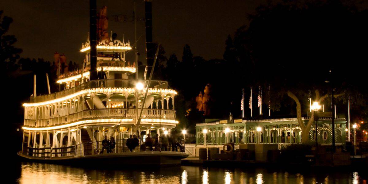 The Mark Twain Riverboat sails the Rivers of America at Disneyland at night