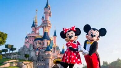 Mickey and Minnie Mouse in front of castle in Disneyland Paris
