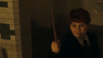 Ron Weasley holding a wand