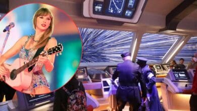 Taylor Swift performing on guitar inside a Star Wars spaceship control room, surrounded by Star Wars characters in costume, bringing together music and galactic adventure for fans.