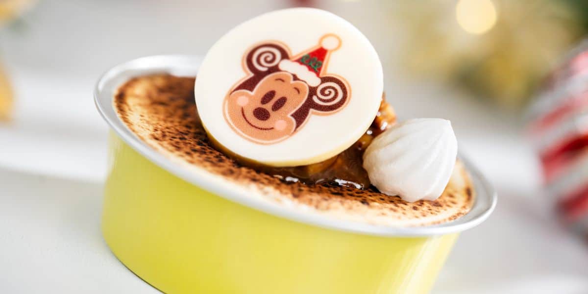 Holiday crème brûlée at Disney World, finished with a white chocolate Mickey Mouse medallion.