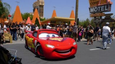 Lightning McQueen parked in front of the Cozy Cone Motel in Cars Land at Disneyland Resort.