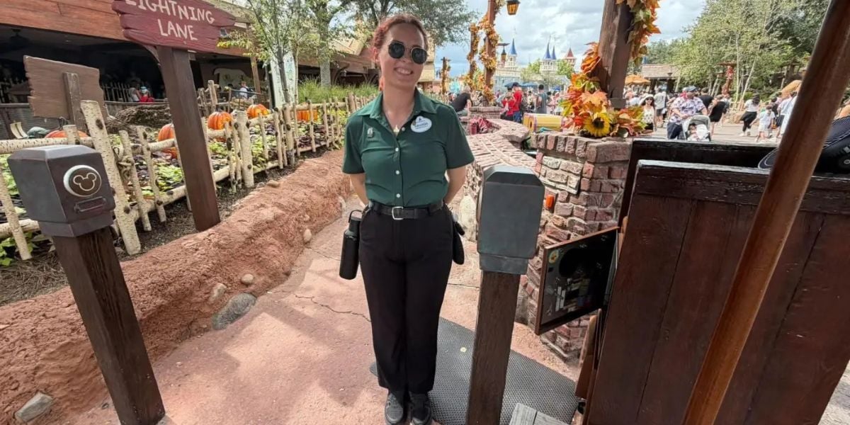 A Cast Member at the Tiana’s Bayou Adventure Lightning Lane entrance in Magic Kingdom.