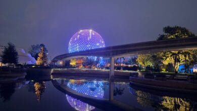 Spaceship Earth glowing at night at EPCOT