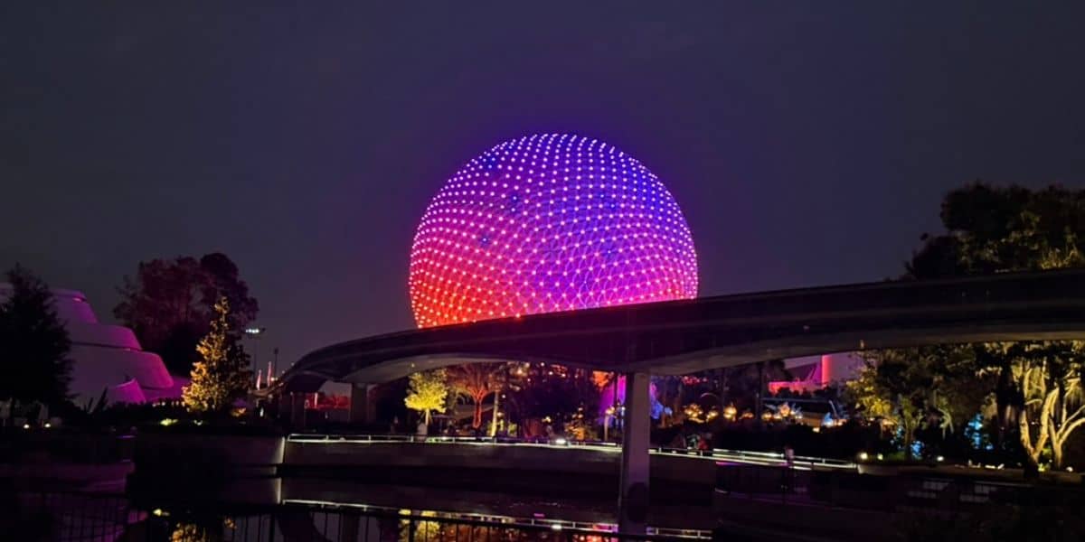 Spaceship Earth lit up at night at EPCOT