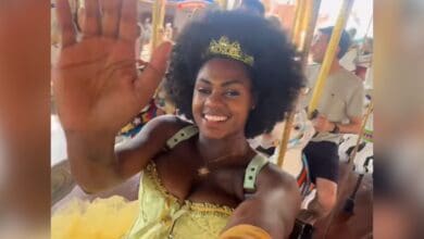 A guest riding the carrousel at Walt Disney World in a corset that she was later told violated the dress code.