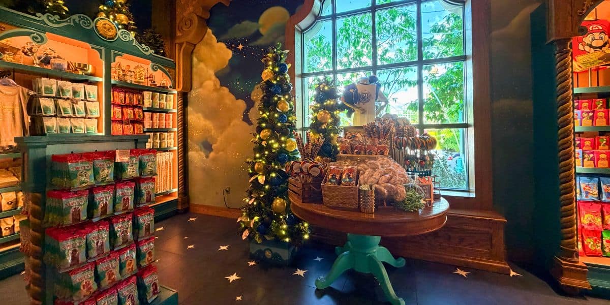 Christmas decorations and candy displays inside 1-Up Factory at Super Nintendo World in Universal Epic Universe.