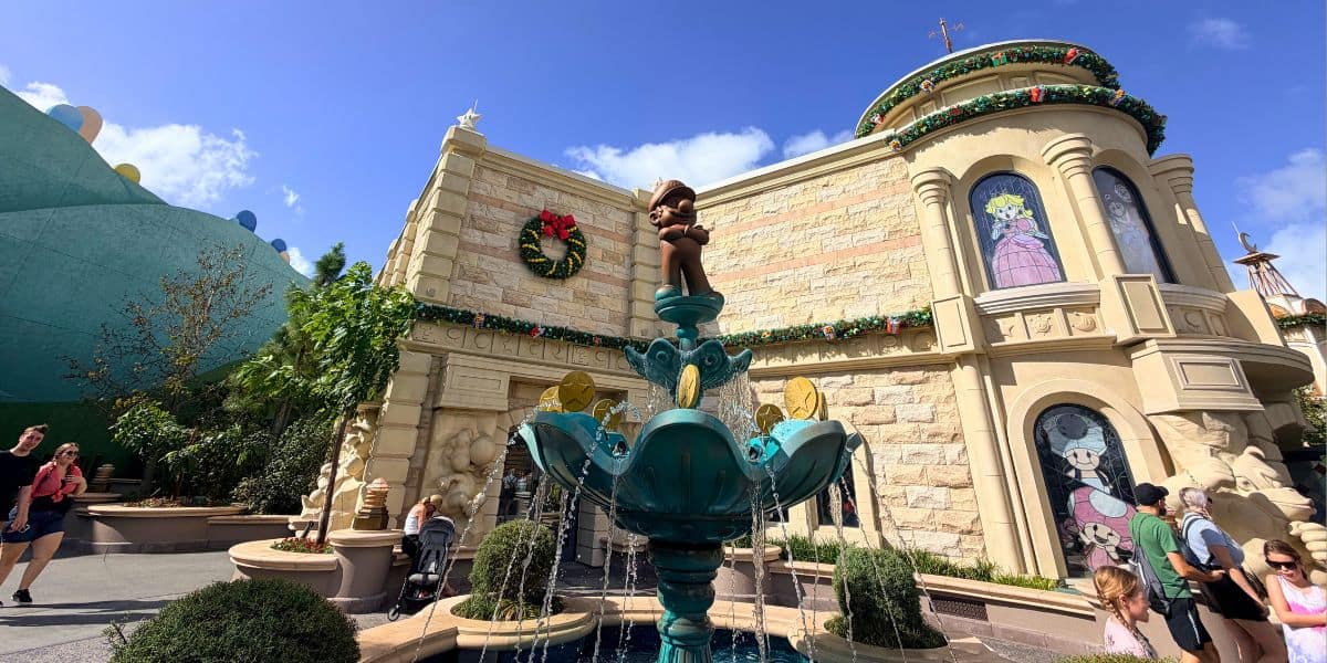 Mario statue and fountain at Super Nintendo World in Epic Universe.