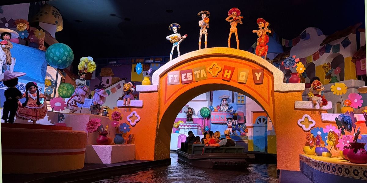 Coco skeletons perform on the yellow archway during the Gran Fiesta Tour at EPCOT.