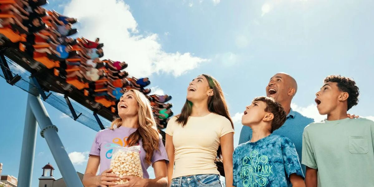 A family gazing up at Candymonium at Hersheypark.