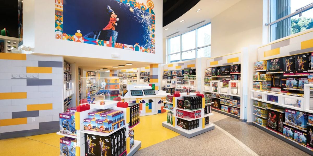 The LEGO Store at Disney Springs featuring a Sorcerer Mickey mural.