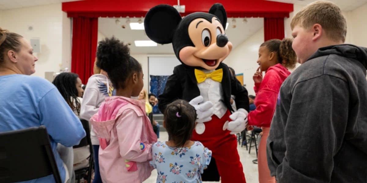 Mickey Mouse greets children at a North Carolina community center.