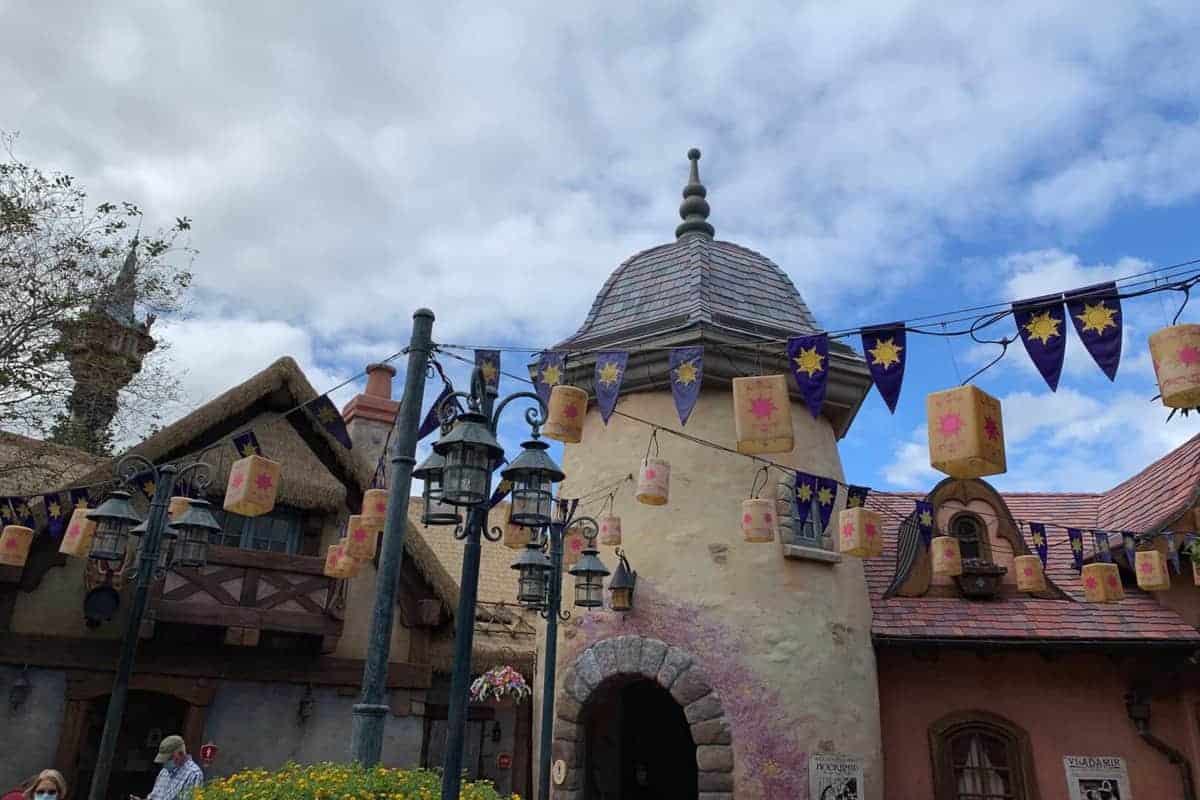 Rapunzel’s tower at Magic Kingdom glowing with floating lanterns.